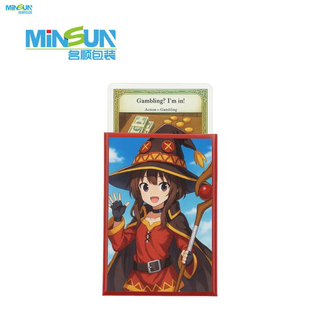Card sleeve with anime girl in red-black outfit and hat, holding staff against blue sky background.