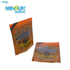 Two orange and gold resealable cigar pouches with ornate designs, used for storing and displaying sample packs