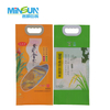 Two rice packaging bags with handles, one orange and one green, each featuring illustrated rice plants and Chinese branding